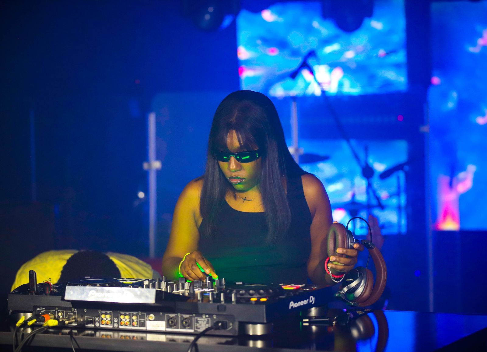 DJ on the decks in blue light