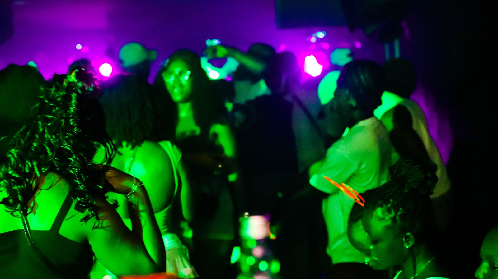 Crowd in purple and green light
