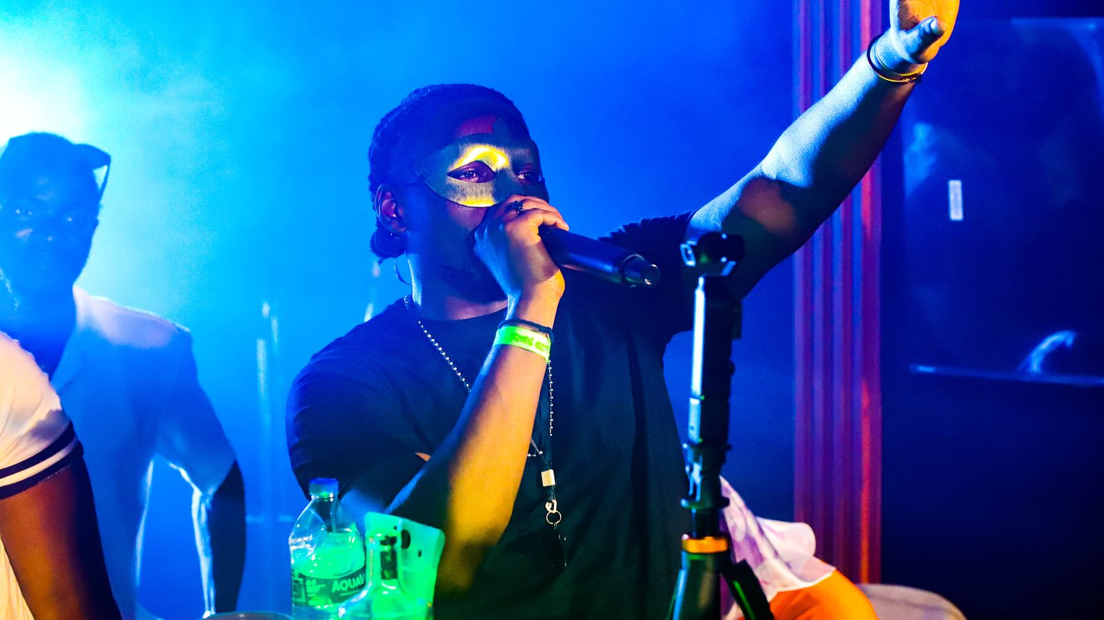 Performer with arm raised